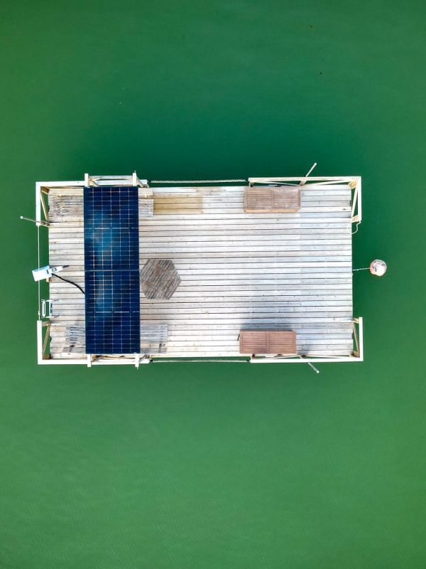 Boat in water bird's eye shot with drone